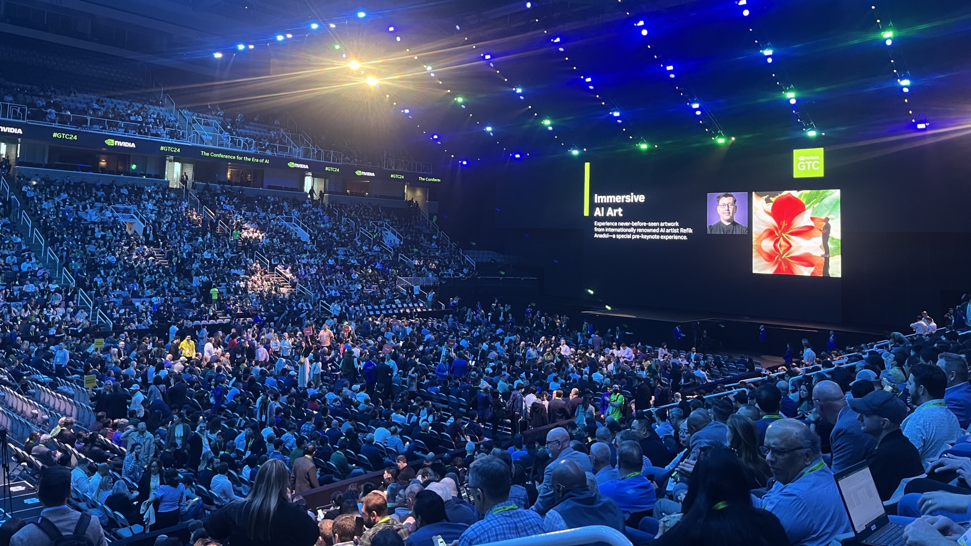 A massive auditorium filled with people waiting to watch a presentation on Immersive AI Art.