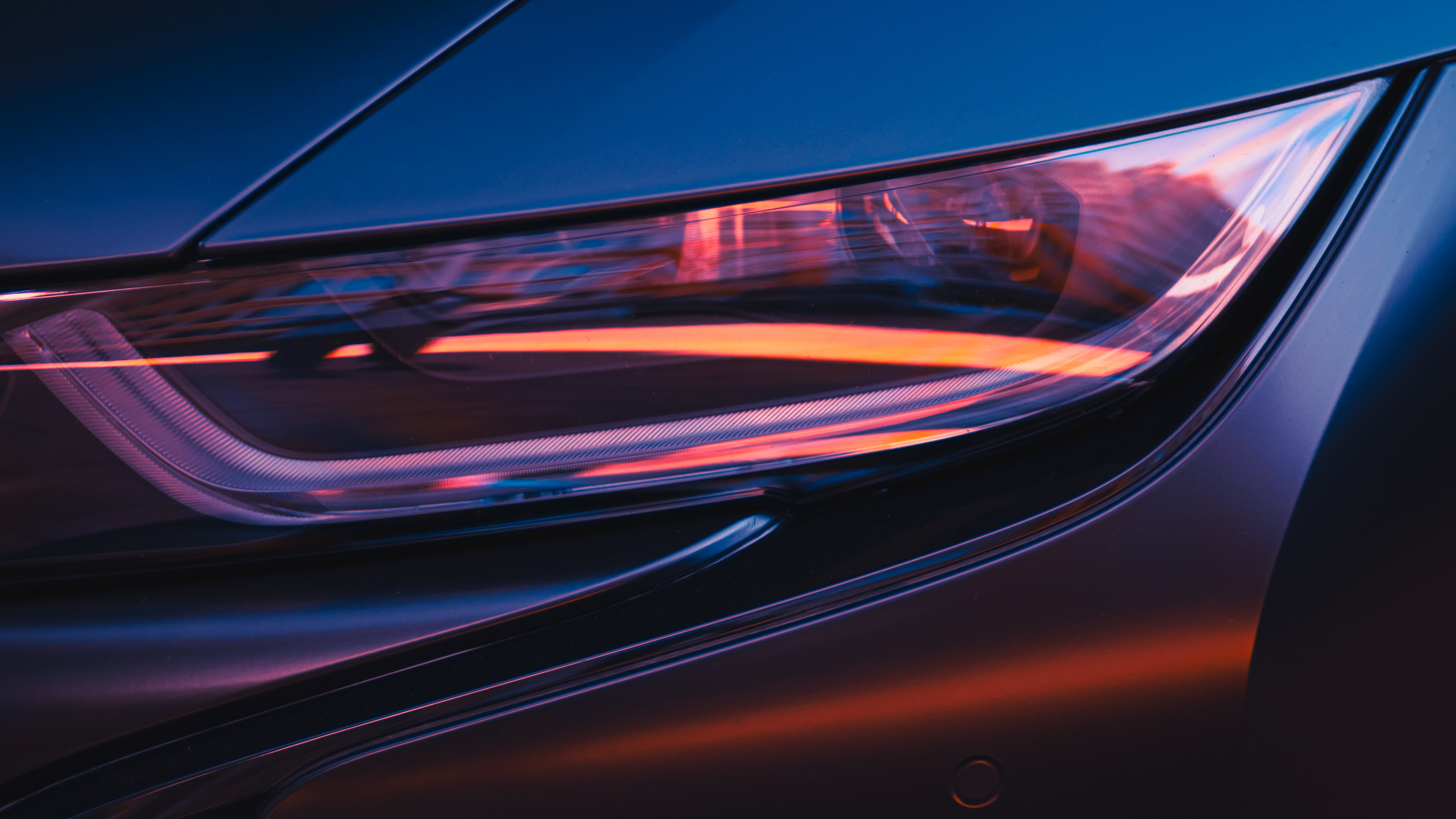 A close up of a car headlight styled.