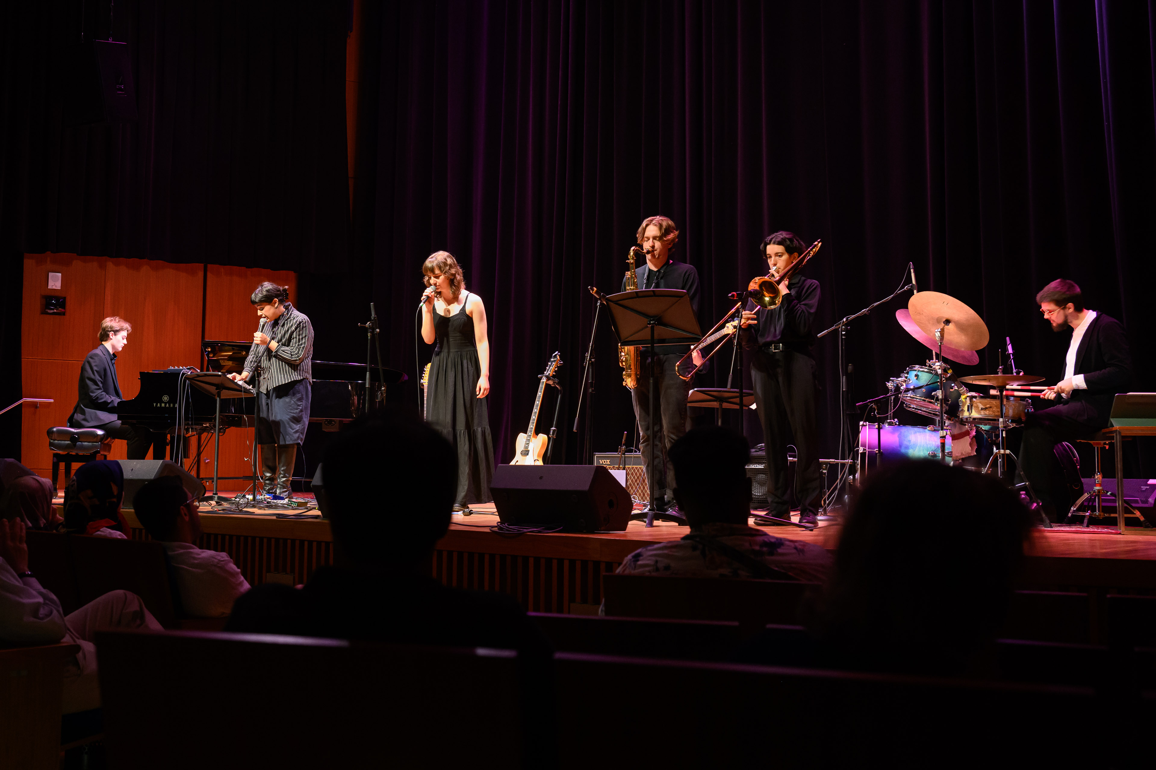     Six performers-a pianist, two singers, a saxophonist, a trombone player and a drummer-on stage at the 2024 Rhythms of Canada concert. 